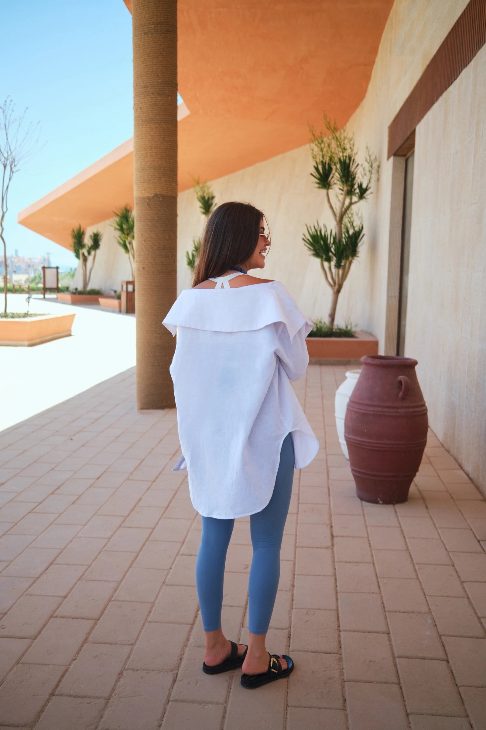 Humanity Code white shirt city look from behind